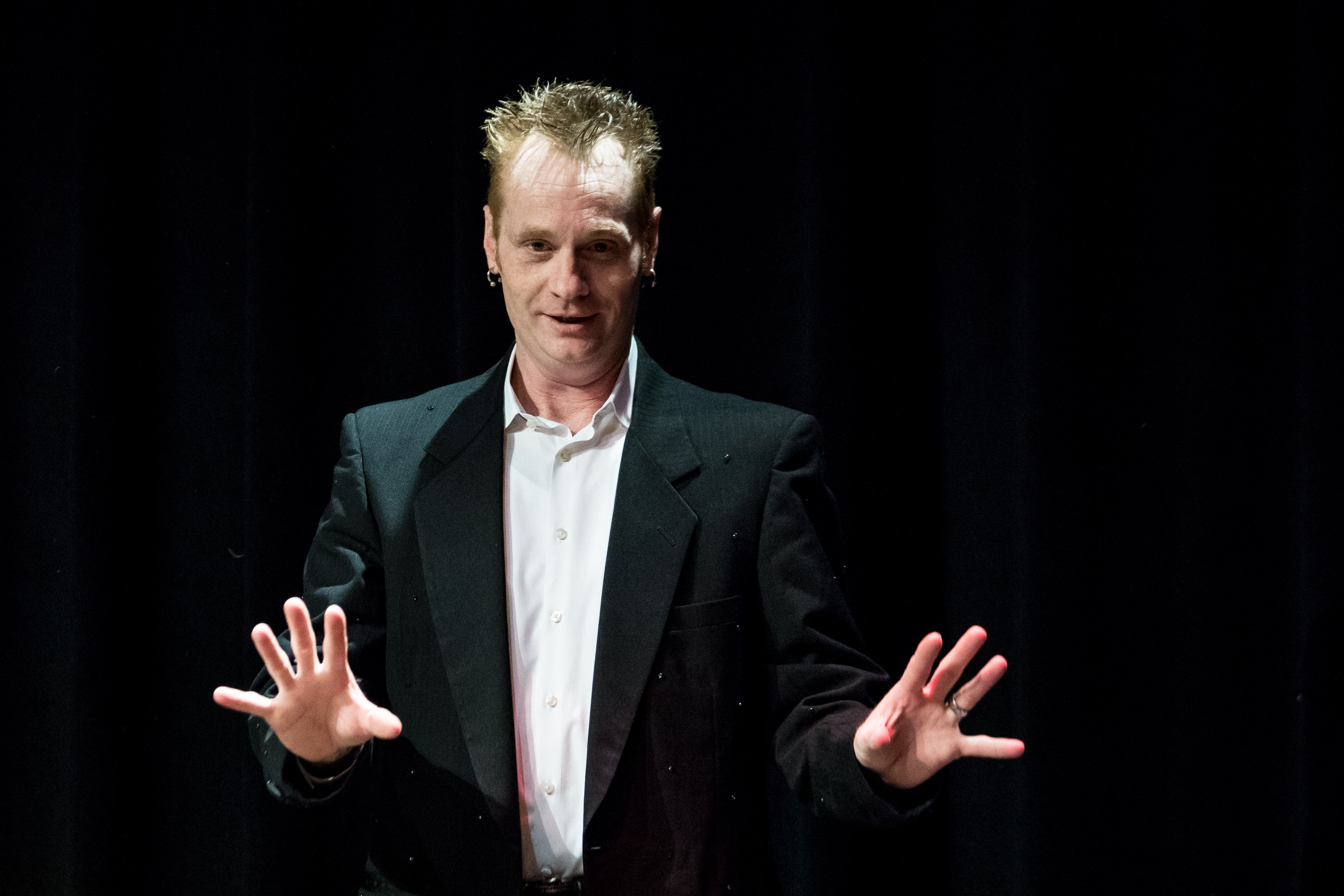 Kristian Charles performing at Indy Magic Monthly at IndyFringe