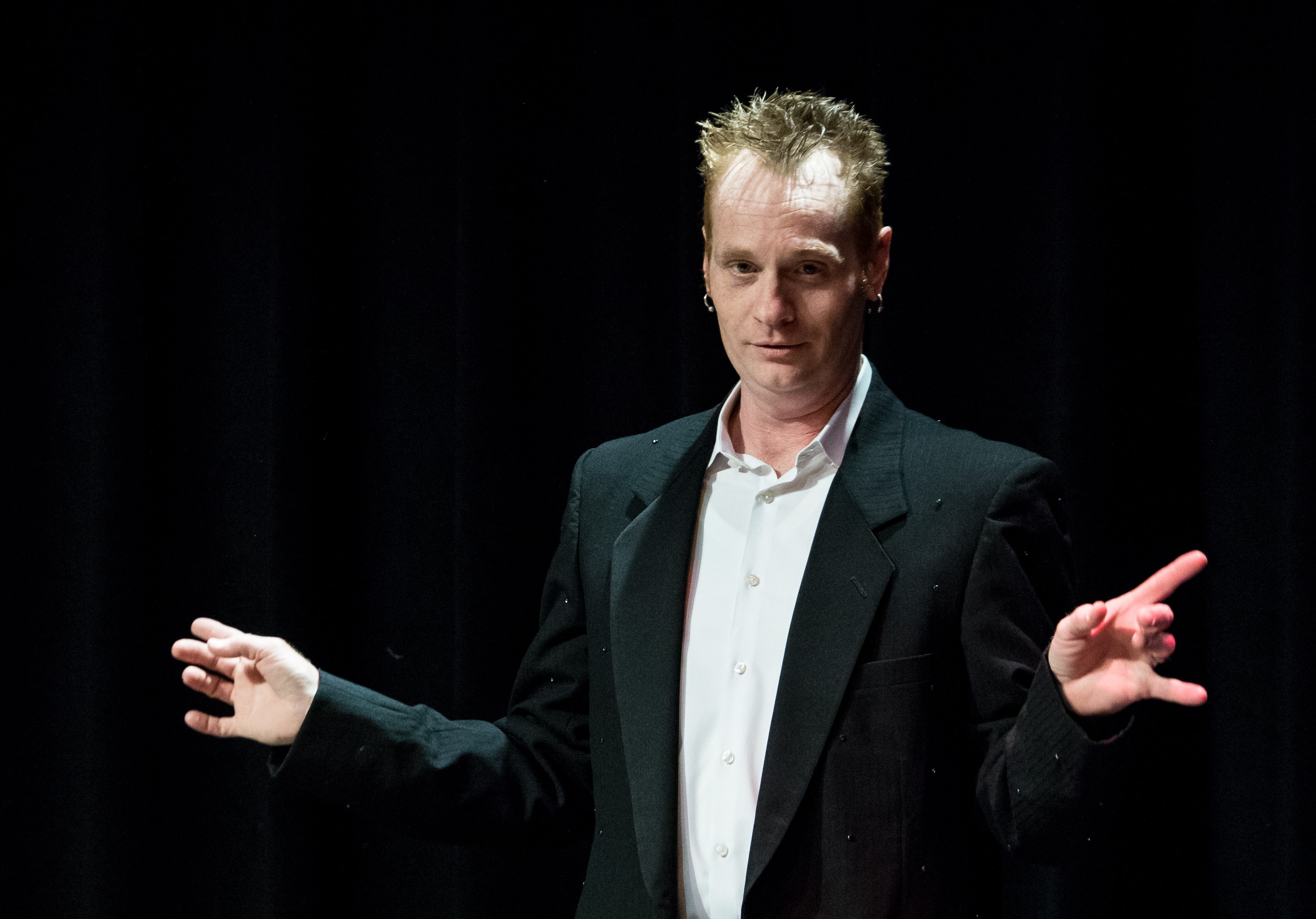 Kristian Charles performing at Indy Magic Monthly at IndyFringe