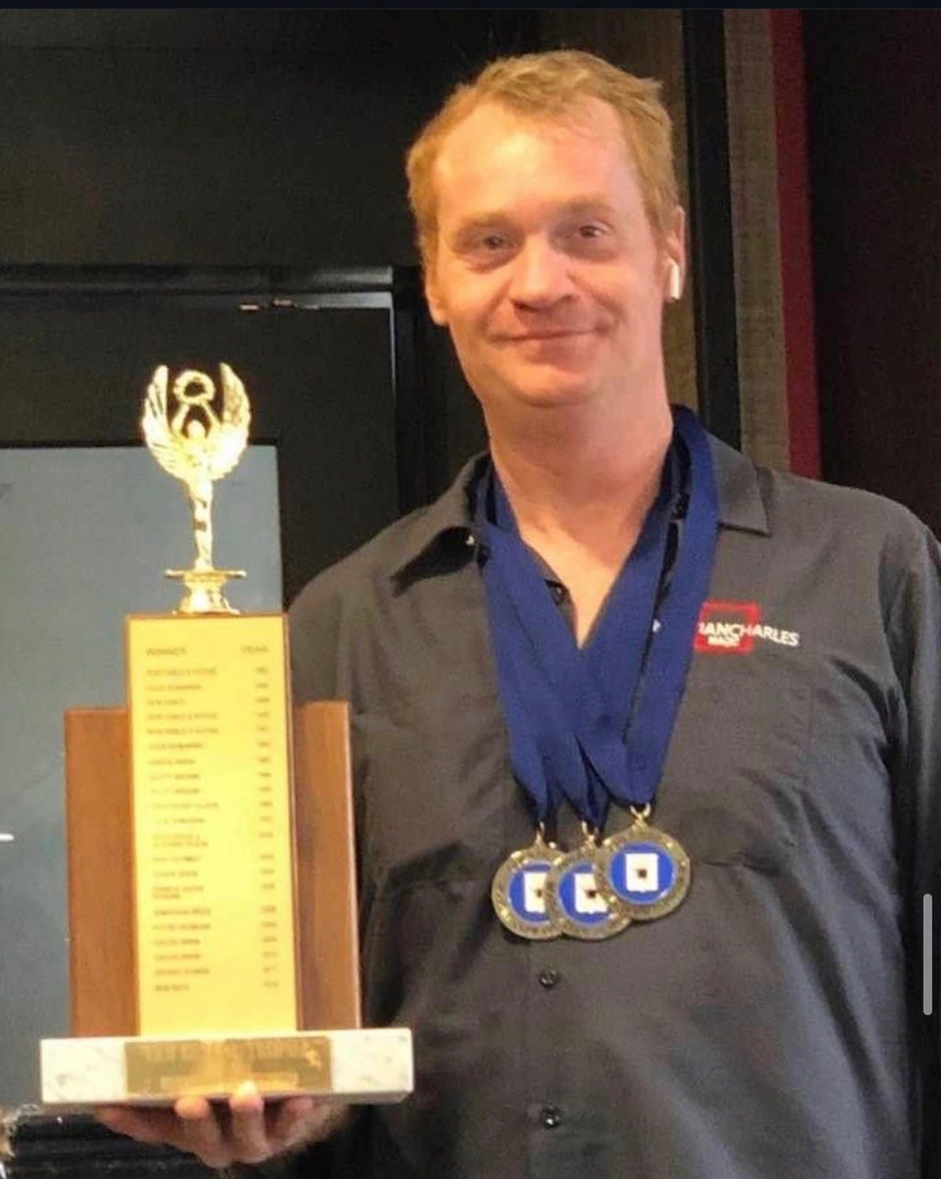 Award-winning magician Kristian Charles with trophy